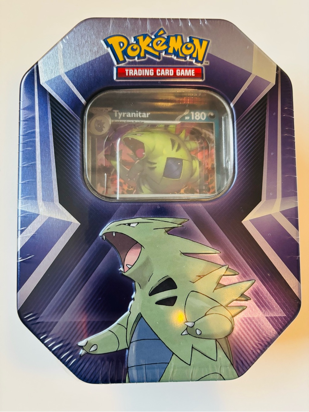 Pokemon Tin with Green Tyranitar Artwork and Purple Blue Packaging